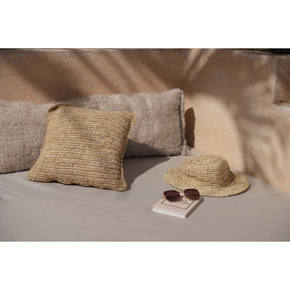 Stylingvoorbeeld beige kussenhoes met andere natuurlijke kussens