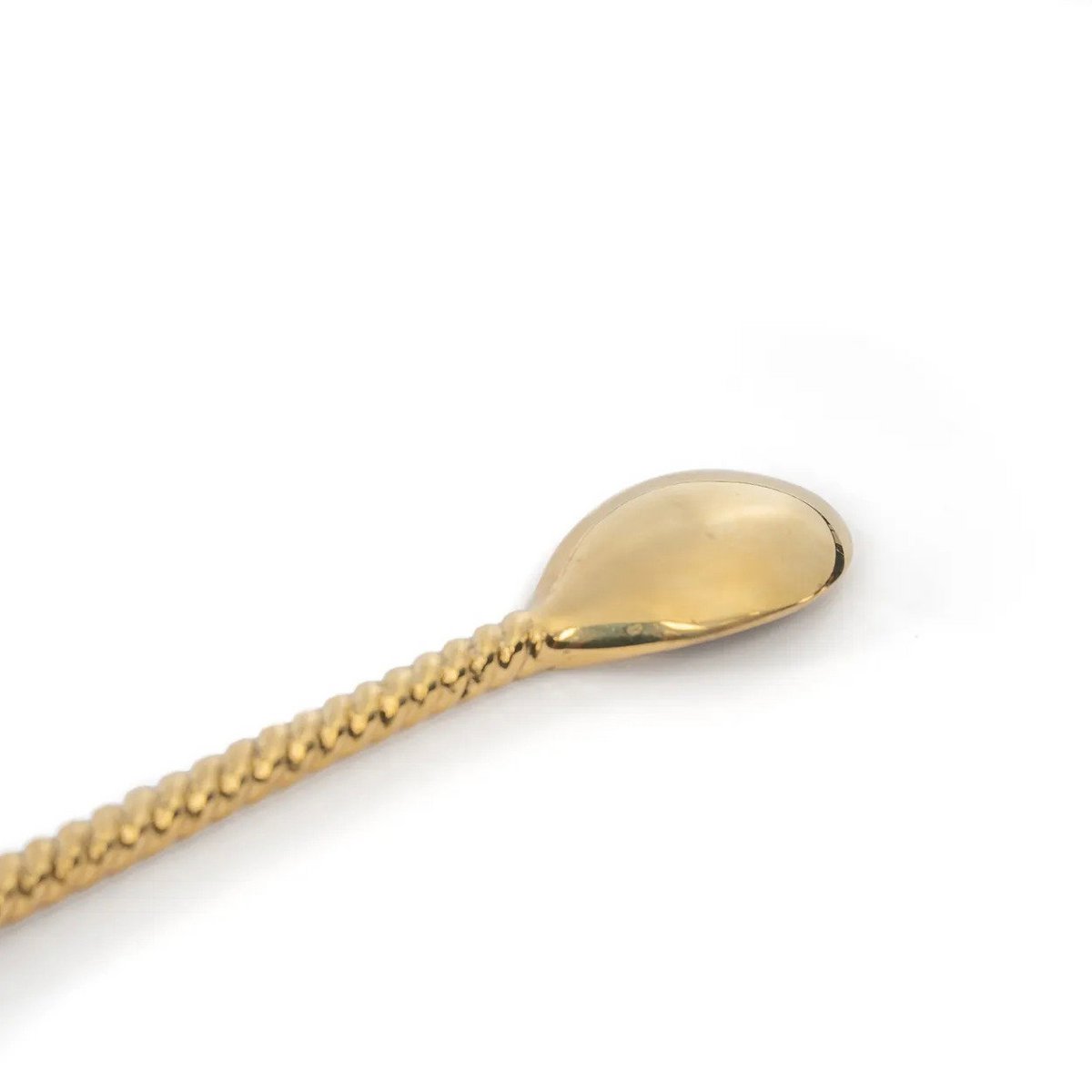 Detail van het uiteinde van de lange lepel goud met palmboom 