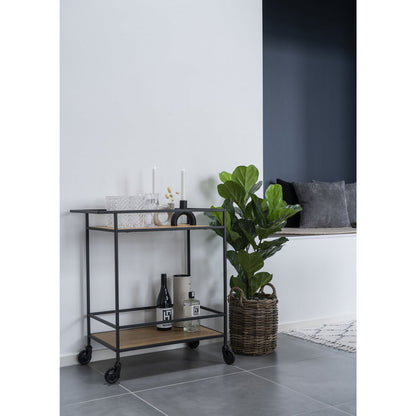 Bartrolley Vita in een modern interieur naast een plant en wanddecoratie