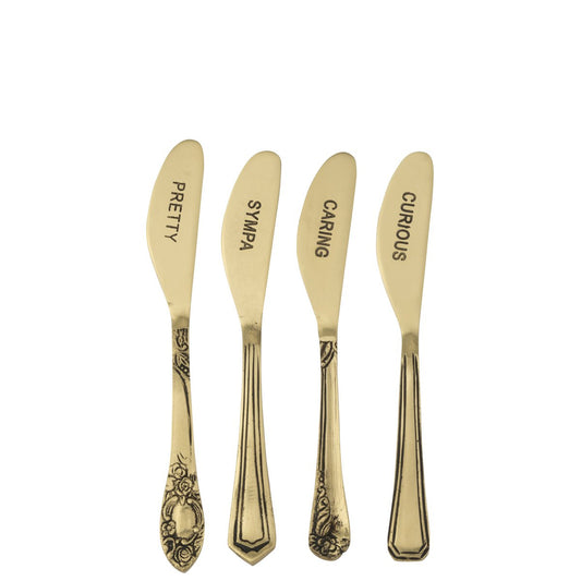 J-Line botermesjes goud set van 4 naast elkaar met de woorden  Pretty, Sympa, Caring en Curious