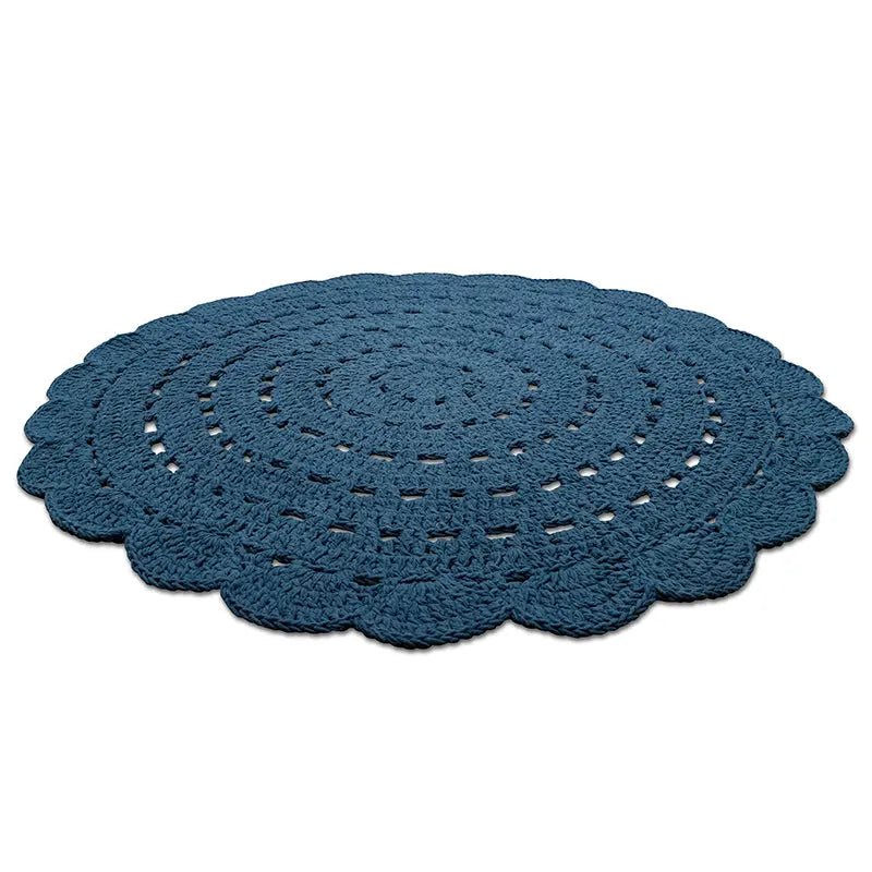 Rond vloerkleed blauw Alma van katoen  schuin van boven