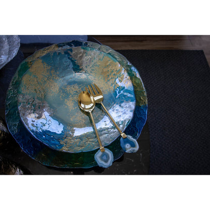Saladebestek goud en Agaat op een blauw bord. Je vindt het meest uitgebreide assortiment saladebestek bij Luben