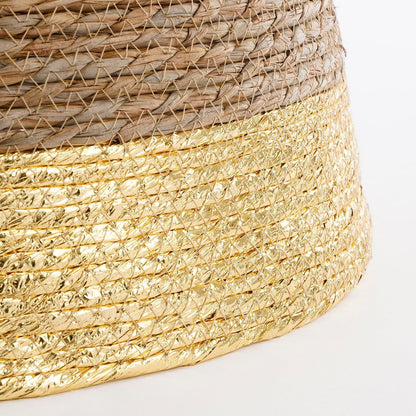 Detail van gouden rand aan rotan boommand – glanzende afwerking voor een luxe uitstraling.

