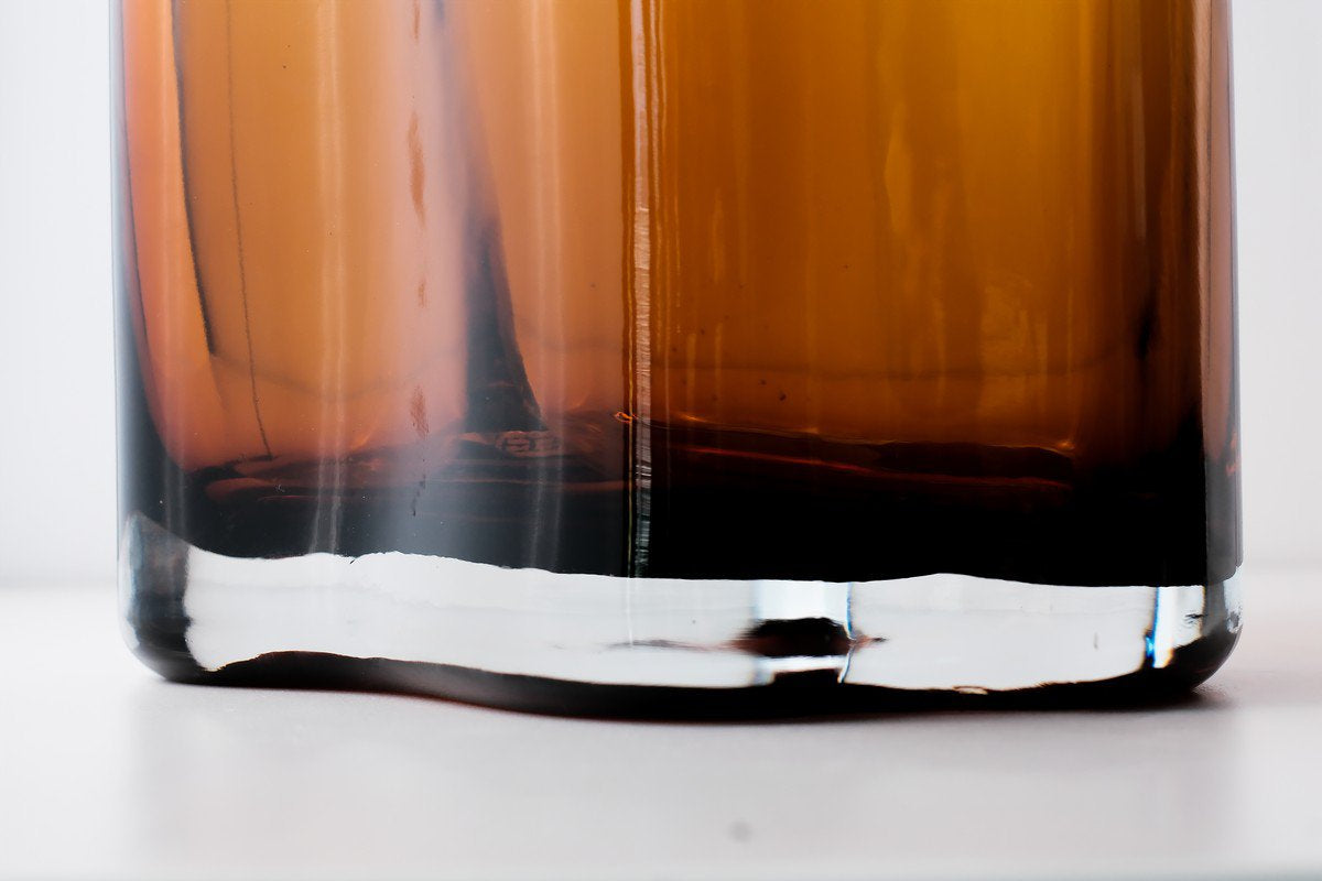 Onderkant lage oranje glazen schaal