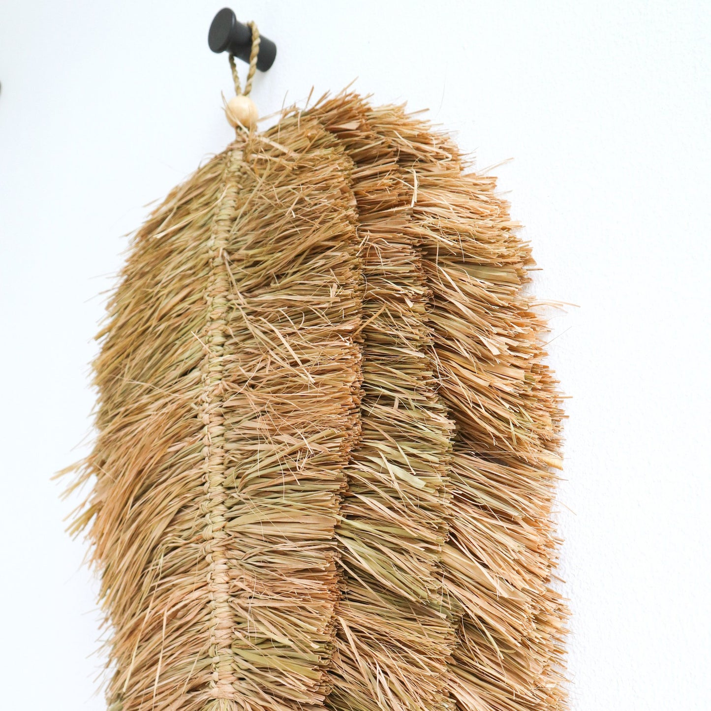 Sfeerfoto Geweven muurschijf Tipin closeup detail