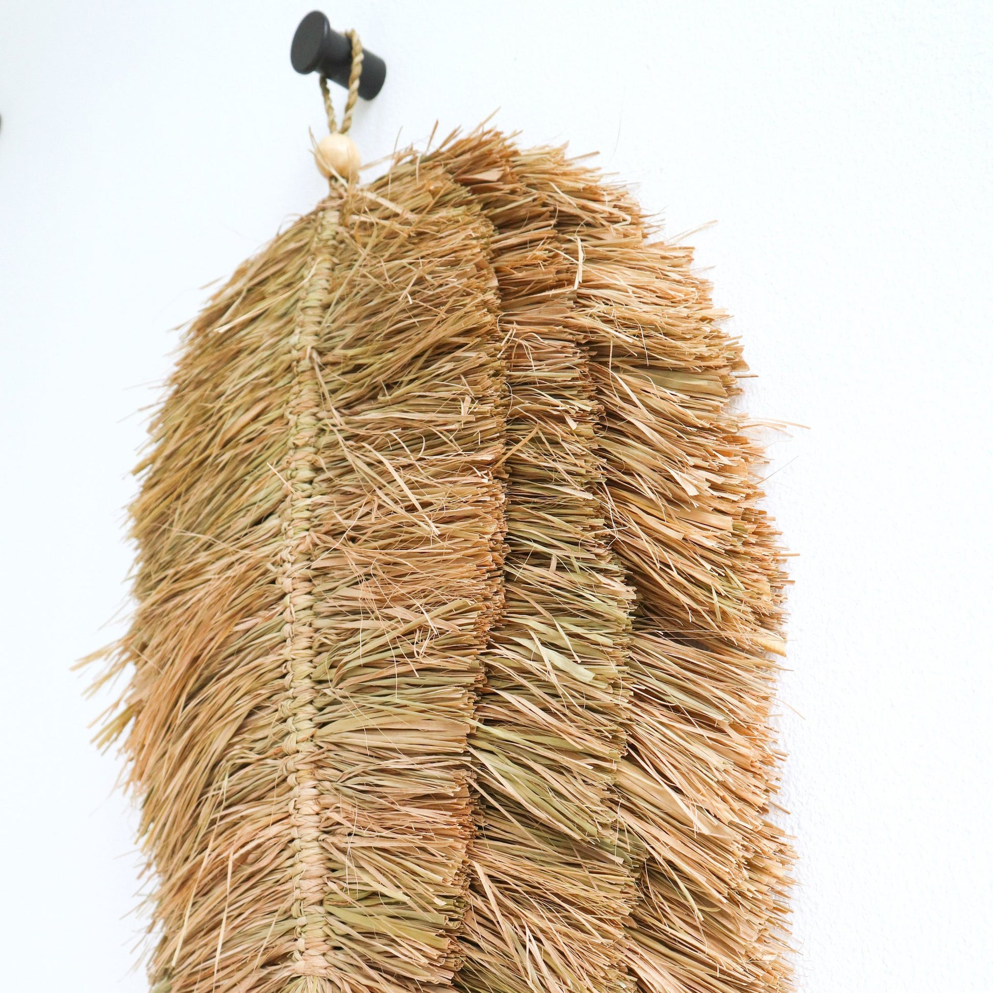 Sfeerfoto Geweven muurschijf Tipin closeup detail